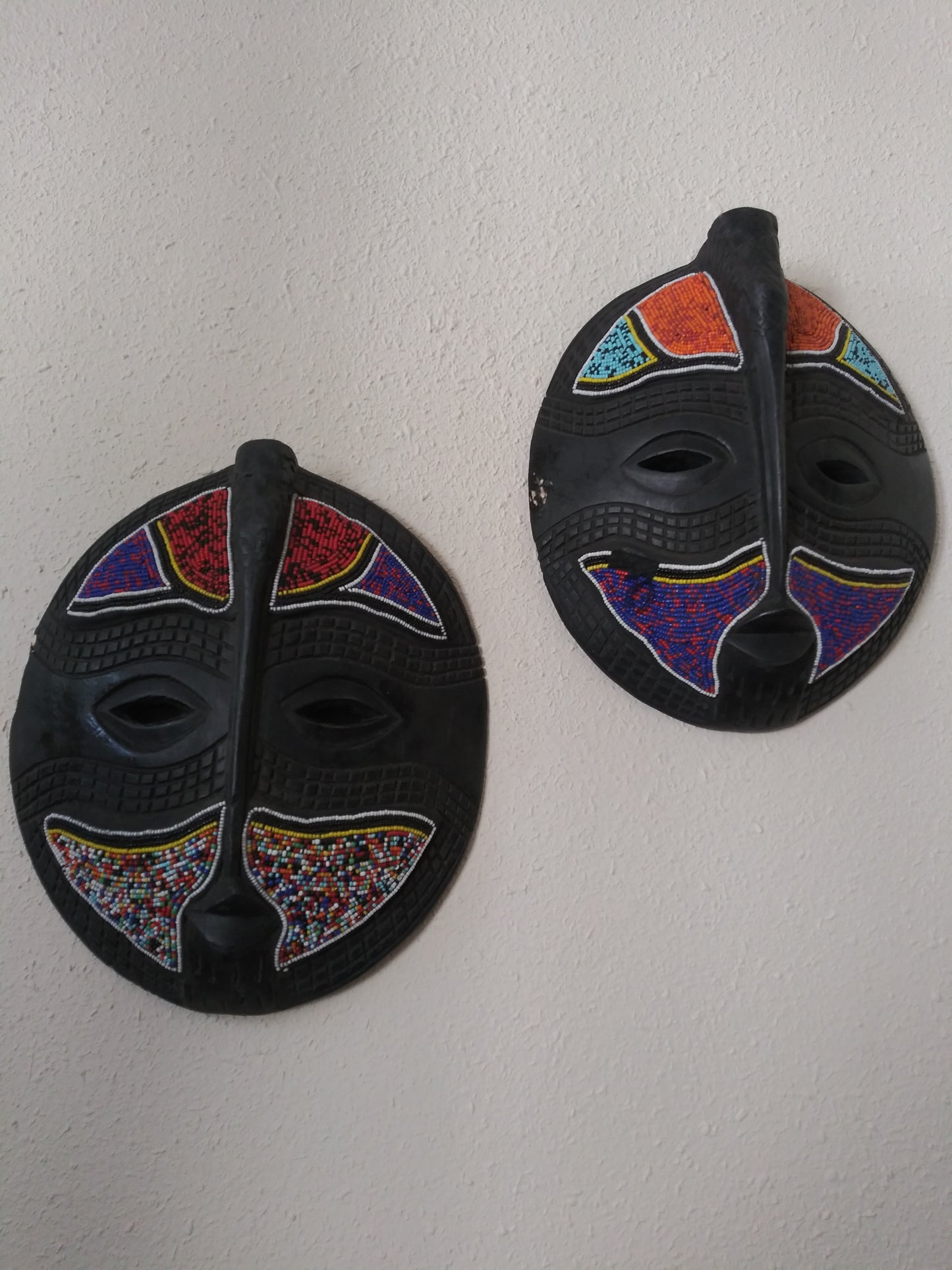 Round colorful wall mask.